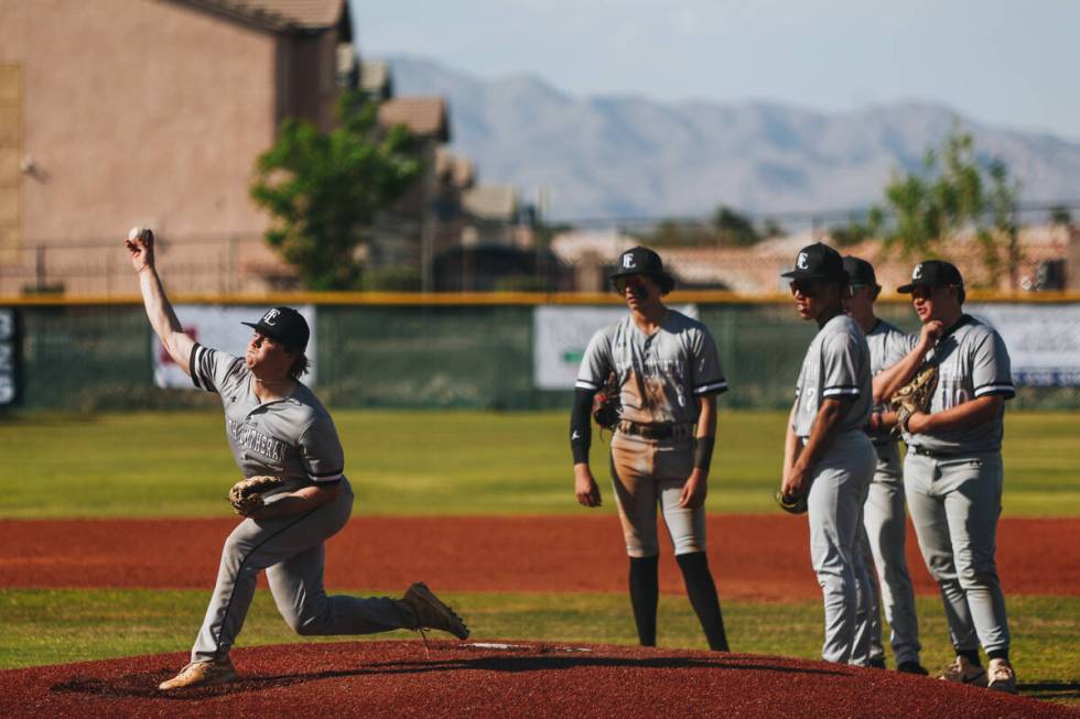 Faith Lutheran pitcher Adrian Dijkman (5) practices pitching from the mound as his teammates lo ...