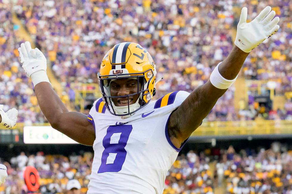 FILE - LSU wide receiver Malik Nabers (8) celebrates after a touchdown by teammate Brian Thomas ...