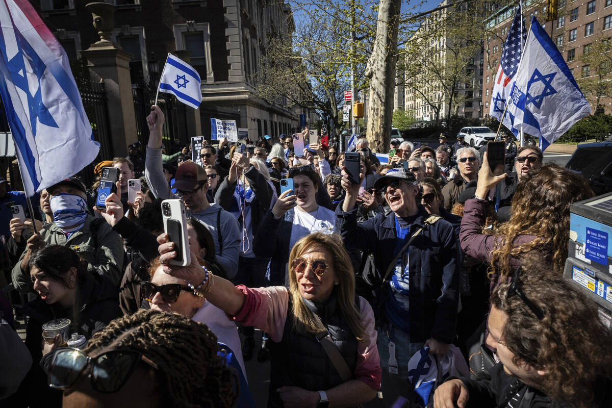 Pro-Israel demonstrators chant "Shame" in support of Columbia University assistant pr ...