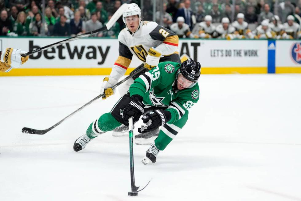 Dallas Stars center Matt Duchene (95) reaches out for the puck while under pressure from Vegas ...