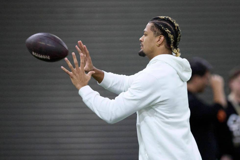 Washington wide reciever Rome Odunze catches the ball during the team's NFL football pro day, T ...