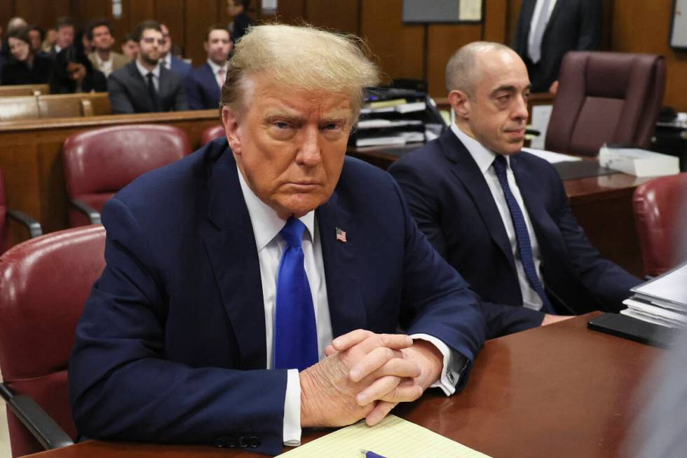 Republican presidential candidate and former President Donald Trump sits in the courtroom at hi ...