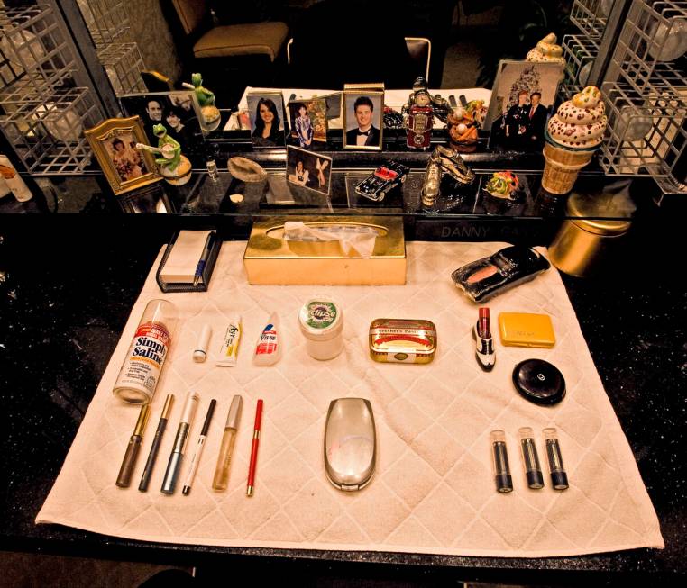 Makeup and family mementos lay on the counter in Danny Gans dressing room at the Encore on Frid ...