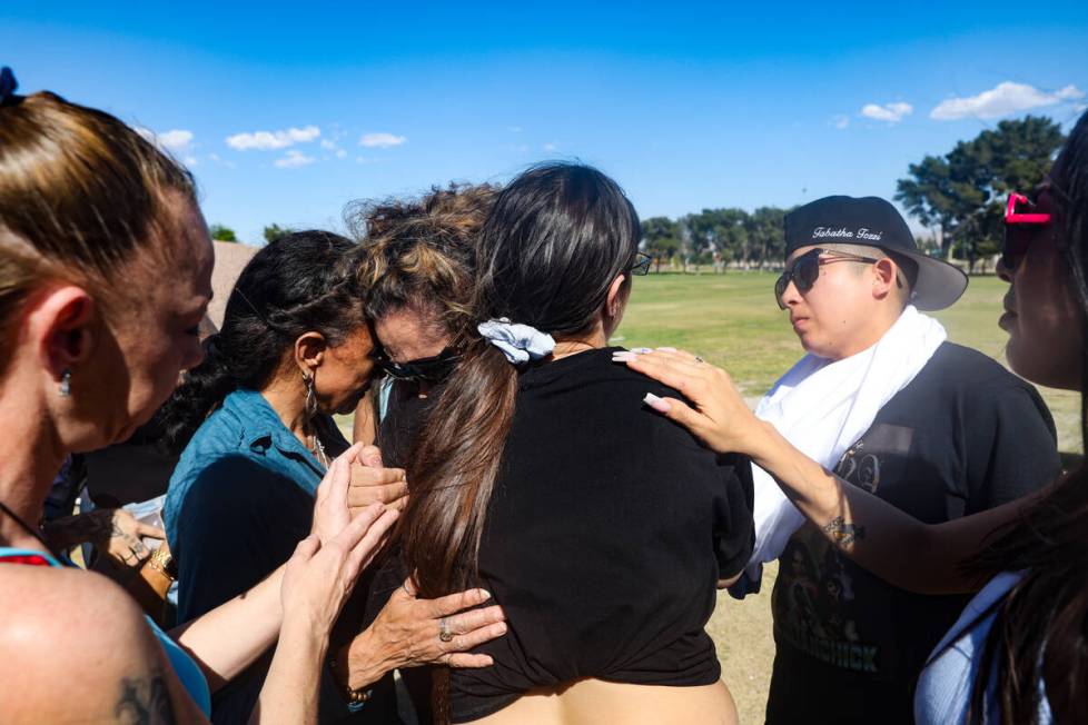 Regina Lacerda, mother of Tabatha Tozzi, is embraced by friends as she cries out after releasin ...