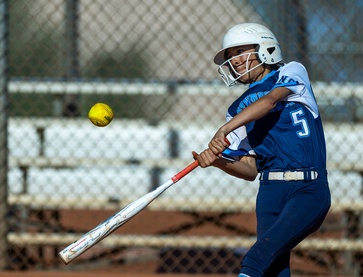 Centennial batter Valeria Lopez (5) connects on a pitch from Palo Verde during the fifth inning ...