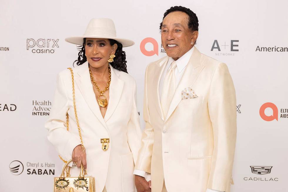 Frances Robinson, left, and Smokey Robinson arrive at the 32nd Annual Elton John AIDS Foundatio ...