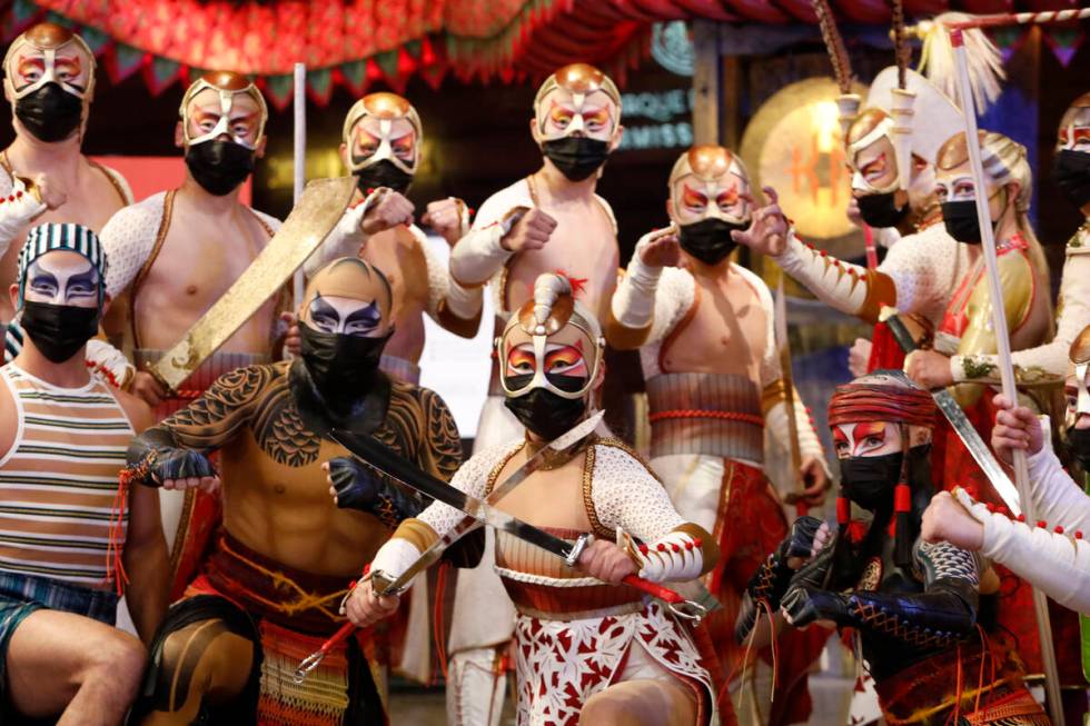 Cirque Du Soleil's KÀ artists pose for a photo in front of the theater before the production's ...