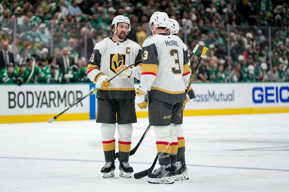 Vegas Golden Knights' Mark Stone (61), Shea Theodore (27) and Brayden McNabb (3) gather during ...