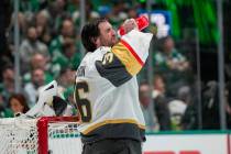 Vegas Golden Knights goaltender Logan Thompson refreshes himself between plays during Game 2 of ...