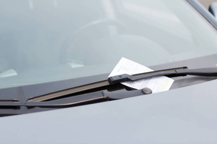A parking ticket is seen on a car windshield in this file photo. (Getty Images)
