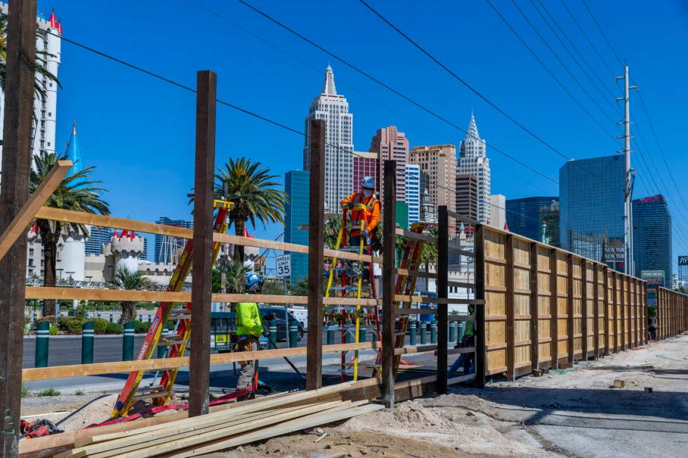 A work crew erects a large fence around the Tropicana Wednesday, April 24, 2024, in Las Vegas. ...