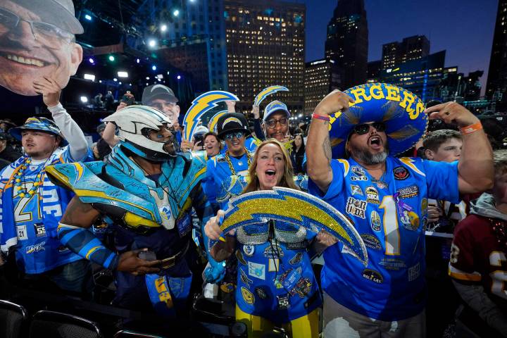 Los Angeles Chargers fans cheer during the first round of the NFL football draft, Thursday, Apr ...