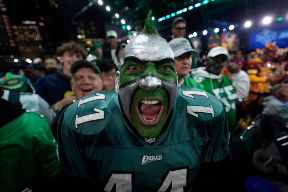 A Philadelphia Eagles fan cheers during the first round of the NFL football draft, Thursday, Ap ...