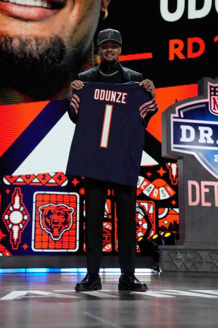 Washington wide receiver Rome Odunze poses after being chosen by the Chicago Bears with the nin ...