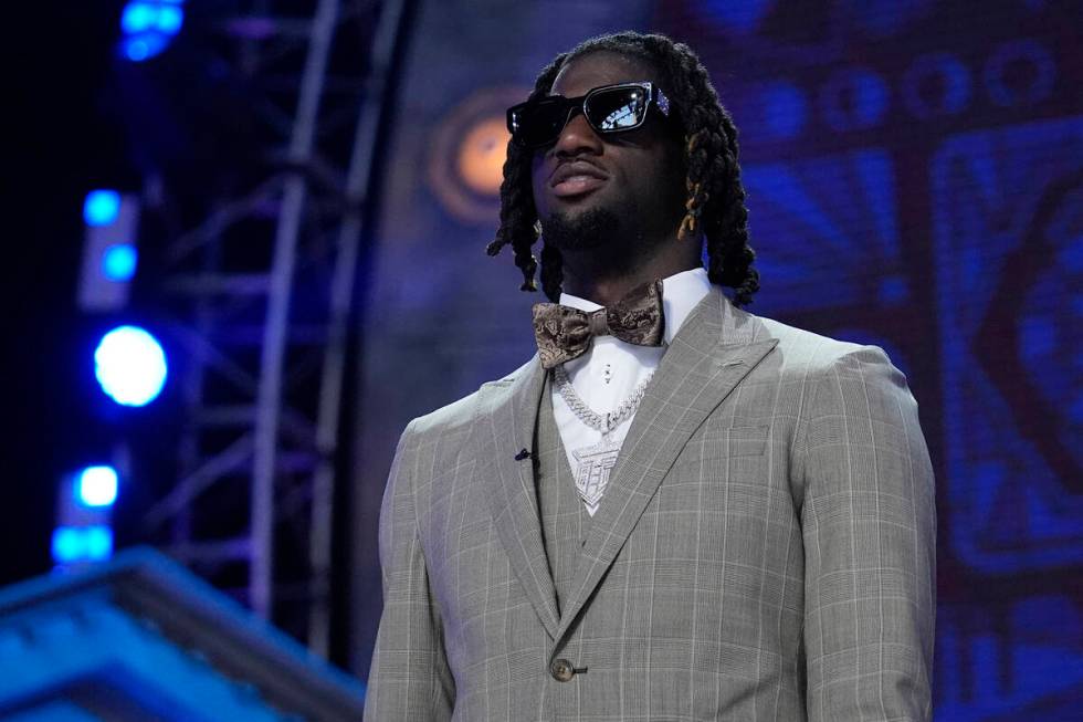 LSU wide receiver Brian Thomas Jr. walks on stage during the first round of the NFL football dr ...