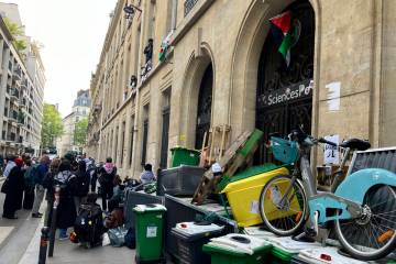 Students block the Sciences Po university Friday, April 26, 2024 in Paris. Students at the pres ...