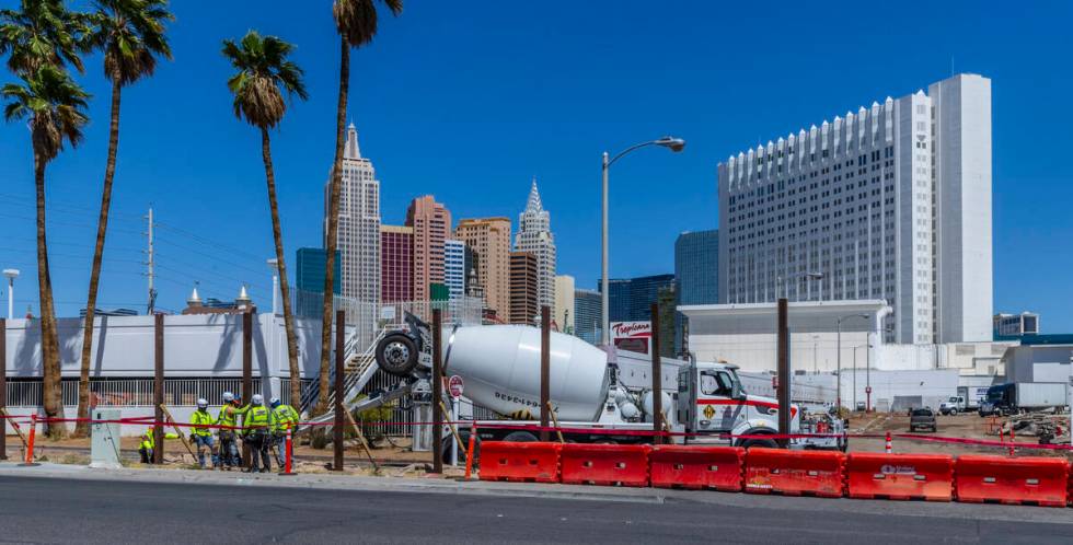 Work continues on the Tropicana hotel-casino as a crew erects a large fence around the property ...