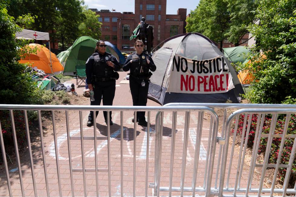 George Washington University police close the student encampment as students protest on the str ...
