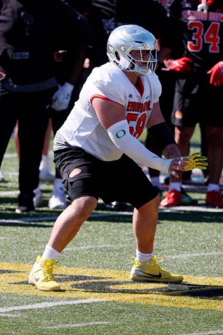 National offensive lineman Jackson Powers-Johnson of Oregon runs through drills during practice ...