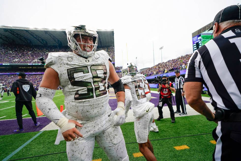 Oregon offensive lineman Jackson Powers-Johnson reacts after wide receiver Tez Johnson (15) mad ...