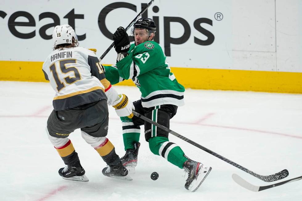 Vegas Golden Knights defenseman Noah Hanifin (15) and Dallas Stars right wing Evgenii Dadonov ( ...