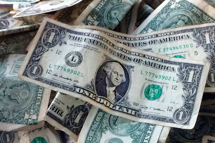 Dollar bills are shown in New York, Oct. 24, 2016. (AP Photo/Mark Lennihan, File)