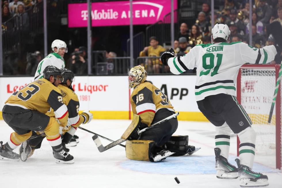 Stars center Tyler Seguin (91) celebrates a score over Golden Knights goaltender Logan Thompson ...