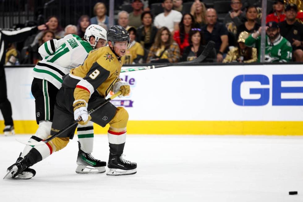 Golden Knights center Jack Eichel (9) passes the puck against Stars center Tyler Seguin (91) du ...