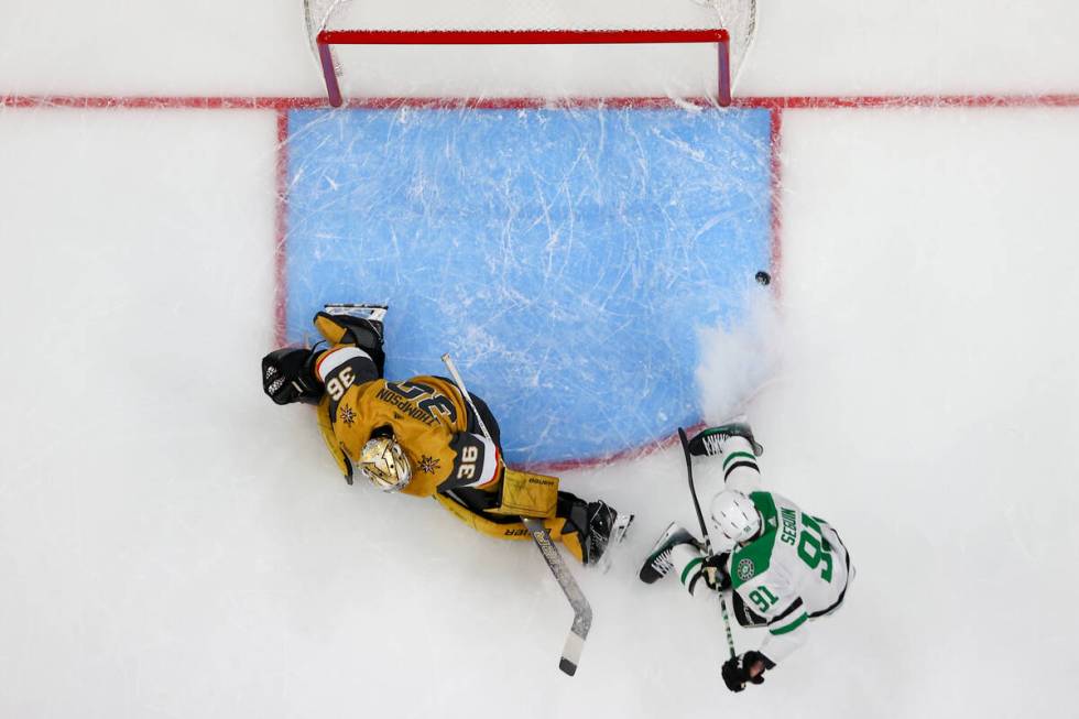 Golden Knights goaltender Logan Thompson (36) saves the puck against Stars center Tyler Seguin ...