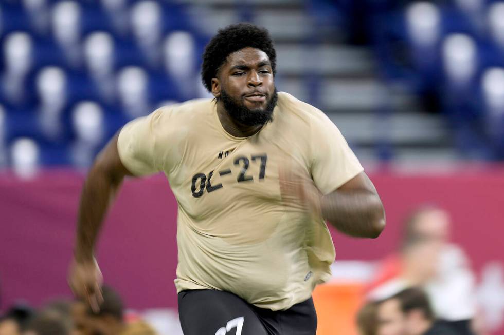 Maryland offensive lineman Delmar Glaze runs the 40-yard dash during the NFL football scouting ...