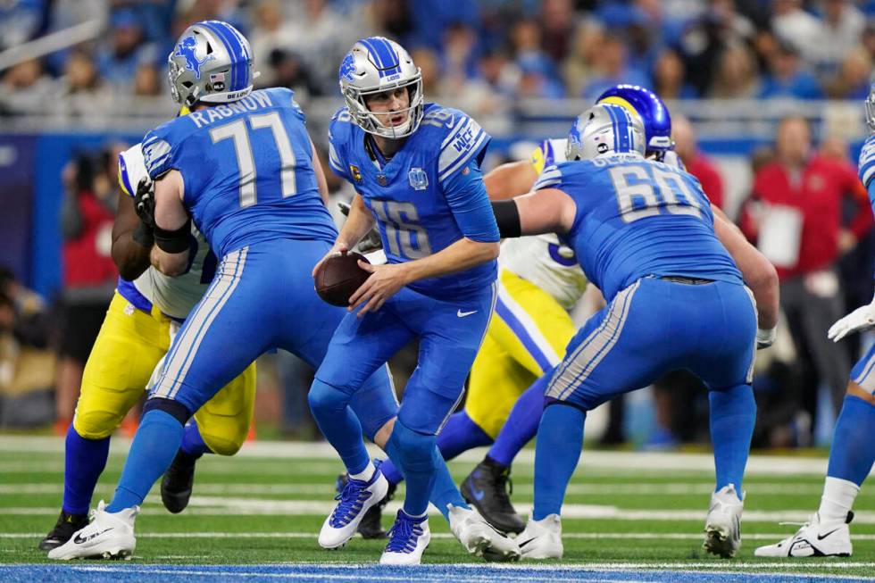 Detroit Lions quarterback Jared Goff (16) looks to handoff during an NFL wild-card football gam ...