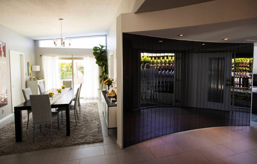 A curved mirror is seen in a 1964 home in the historic Paradise Palms neighborhood during a tou ...