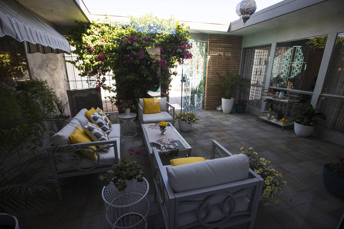 An outdoor sitting area is seen at the entry to a 1964 home in the historic Paradise Palms neig ...