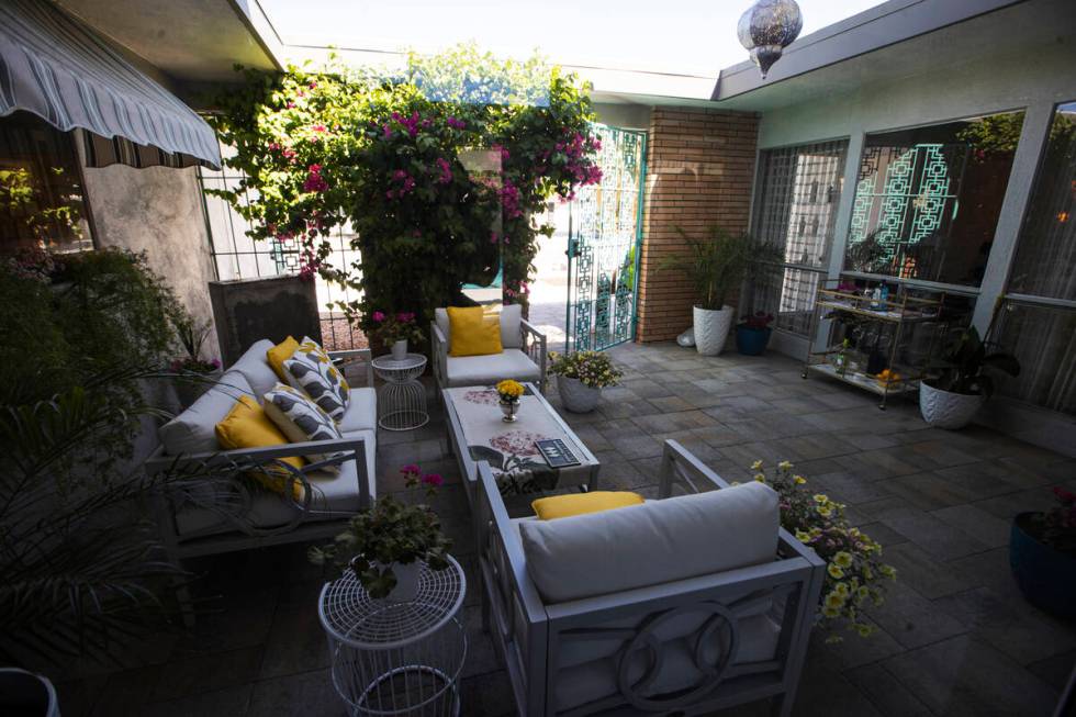 An outdoor sitting area is seen at the entry to a 1964 home in the historic Paradise Palms neig ...