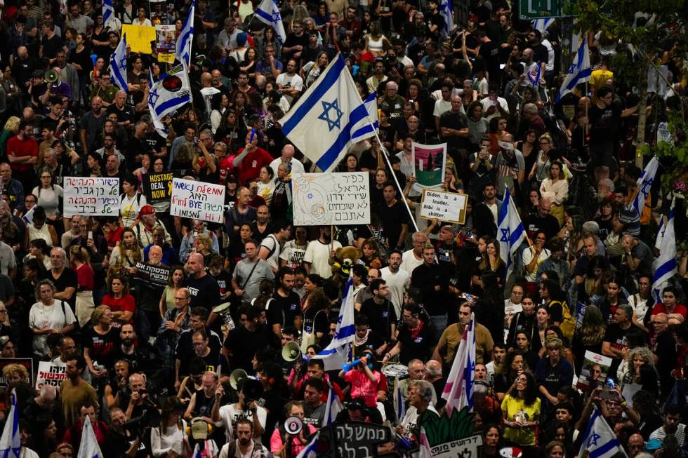 People protest against Israeli Prime Minister Benjamin Netanyahu's government and call for the ...