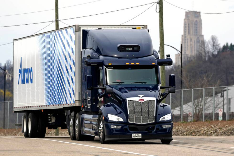 A self-driving tractor trailer maneuvers around a test track in Pittsburgh, Thursday, March 14, ...