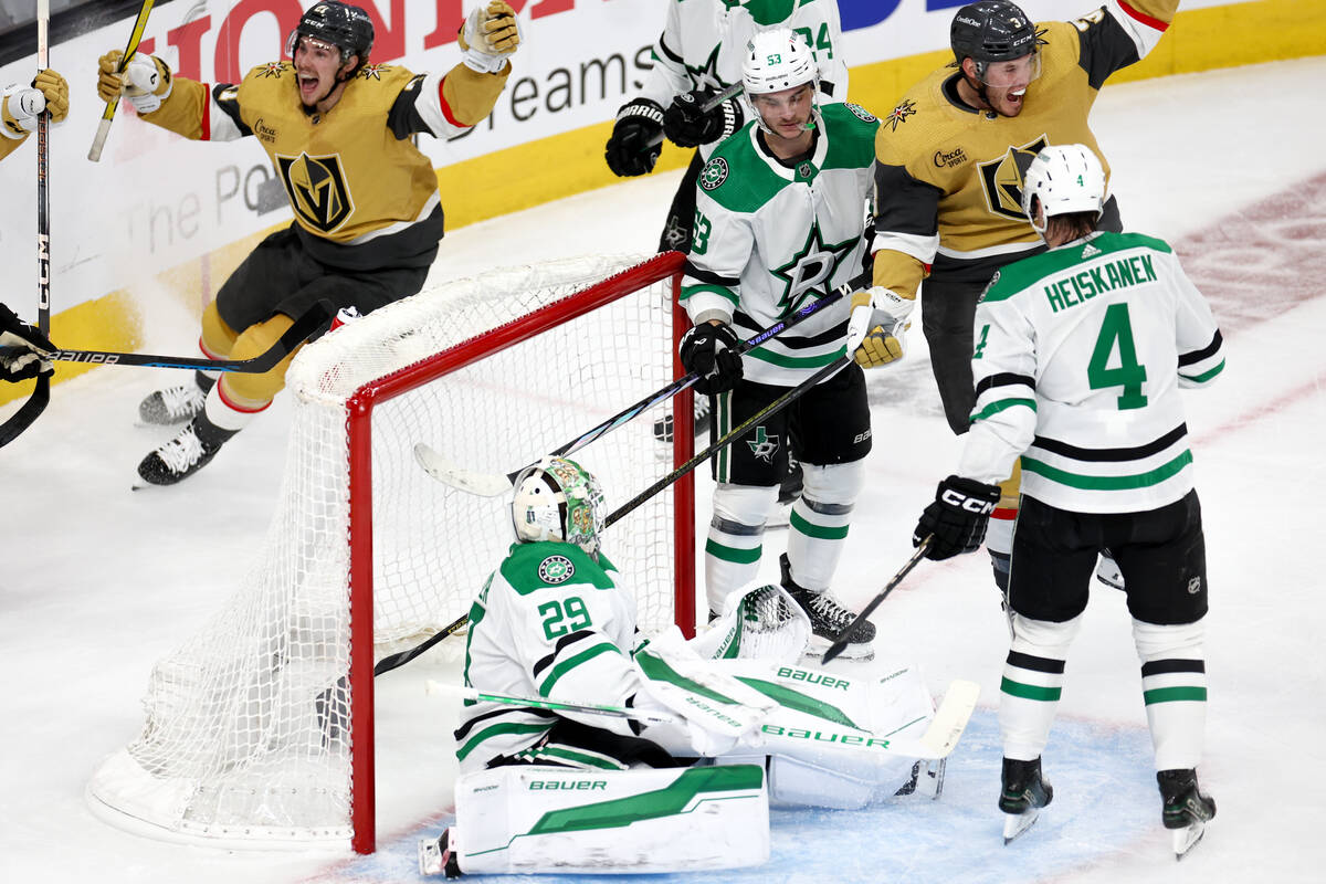 Golden Knights center Brett Howden (21) and defenseman Brayden McNabb (3) celebrate after right ...