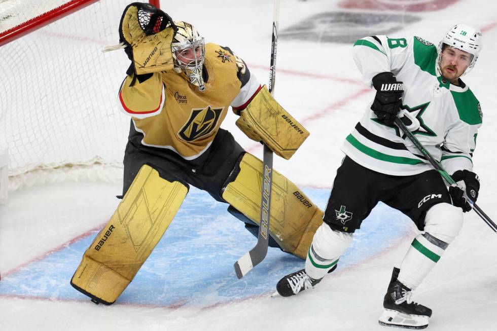 Golden Knights goaltender Logan Thompson (36) makes a glove save while Stars center Sam Steel ( ...