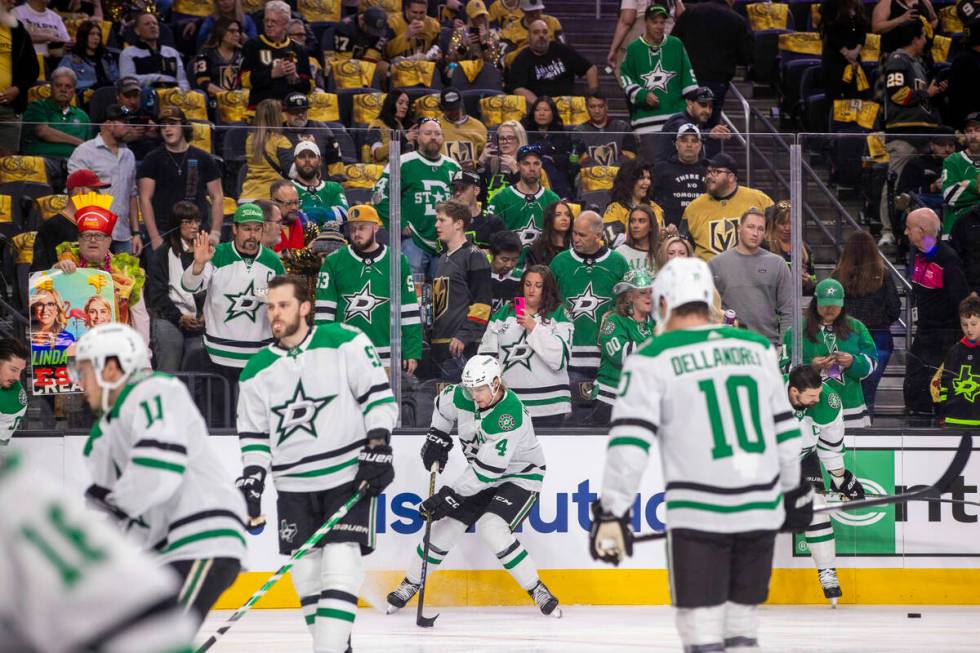 Fans watch as the Dallas Stars get loose during warm ups in Game 4 of their NHL playoff game at ...