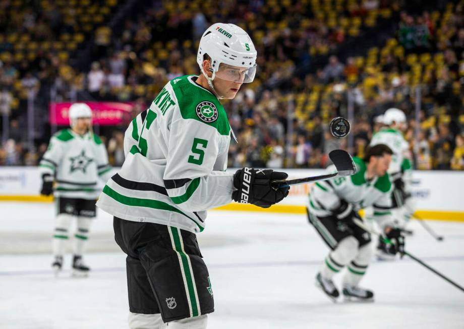 Dallas Stars defenseman Nils Lundkvist (5) flicks up a puck off his stick during warm ups in Ga ...