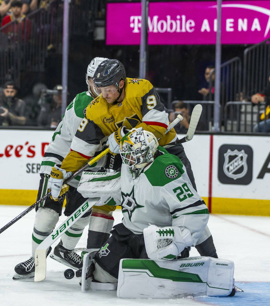 Golden Knights center Jack Eichel (9) battles for a shot against Dallas Stars goaltender Jake O ...