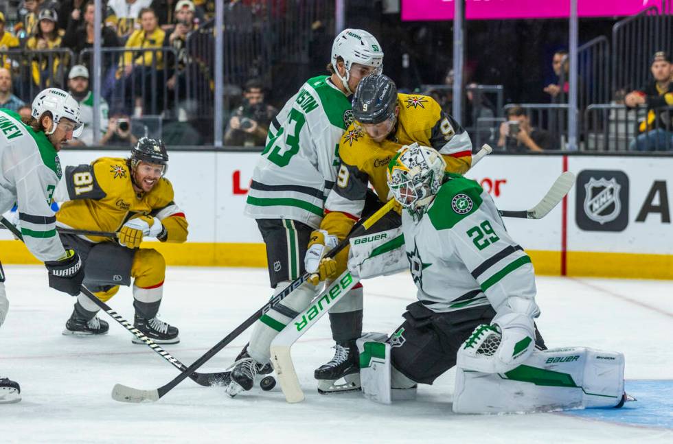 Golden Knights center Jack Eichel (9) battles for a shot against Dallas Stars goaltender Jake O ...