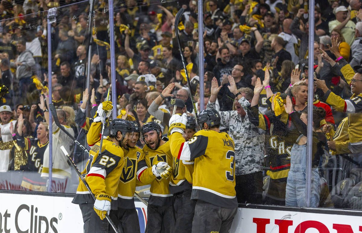 Golden Knights players celebrate a goal by right wing Michael Amadio (22) past Dallas Stars goa ...