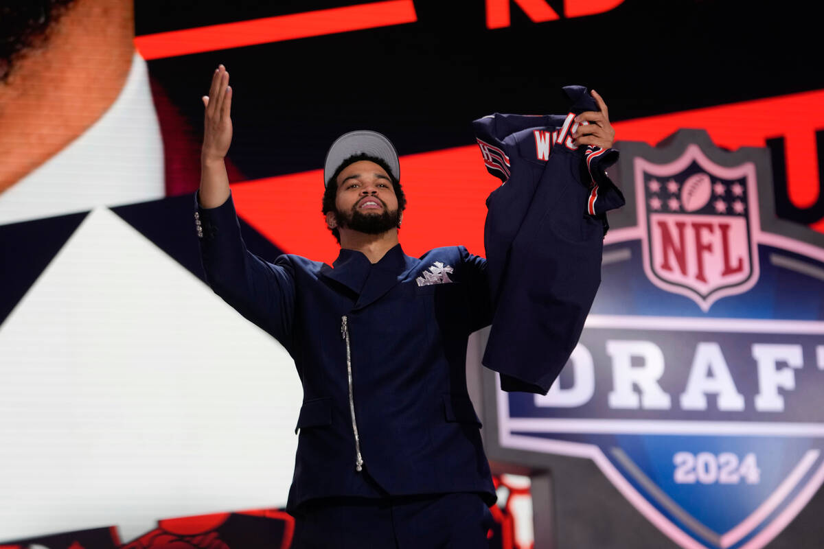 Southern California quarterback Caleb Williams celebrates after being chosen by the Chicago Bea ...