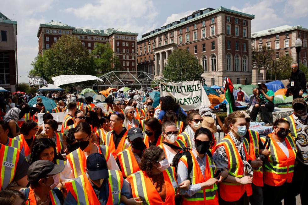 Columbia University faculty and staff gather on the campus in solidarity with student protester ...