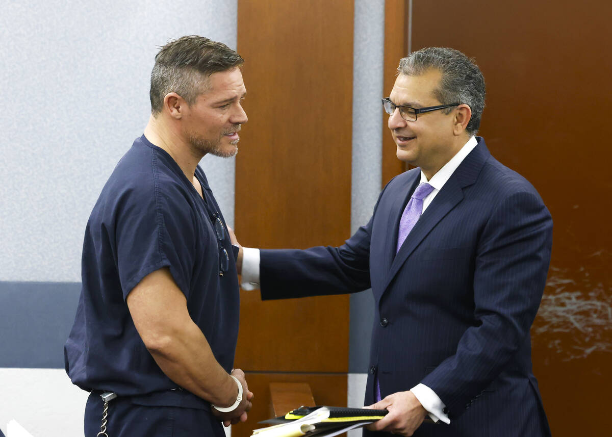 Defense attorney Christopher Oram listens to Jose “Chille” DeCastro, who was sentenced on a ...