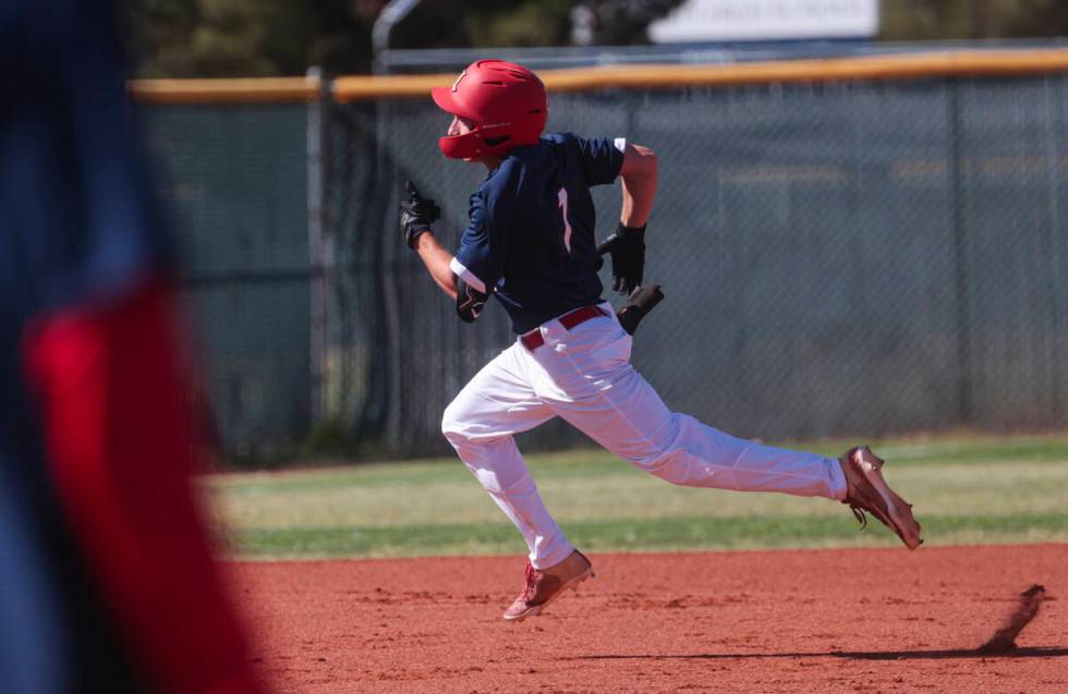 Liberty’s Chris Onoszko runs for third base against Spring Valley during a baseball game ...