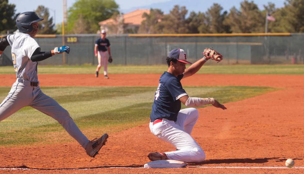 Liberty’s Shawn Mack (24) misses the catch as Spring Valley's Royce Ogawa (22) makes it ...