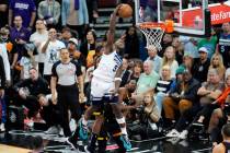 Minnesota Timberwolves guard Anthony Edwards (5) gets past the Phoenix Suns defense for a dunk ...