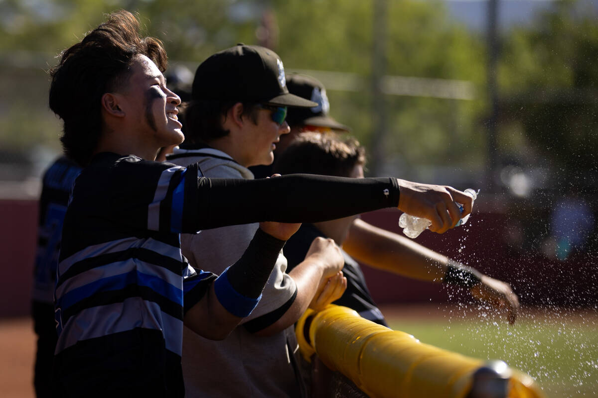 Basic outfielder Troy Southisene (2) celebrates after his brother got on base during a high sch ...